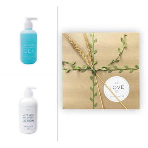 Earthsavers Serene Gift Box with green leaf ribbon, topped with wheat. Images of blue colored, Balance Bath & Shower Gel and Vitamin Lotion to the left of the box.
