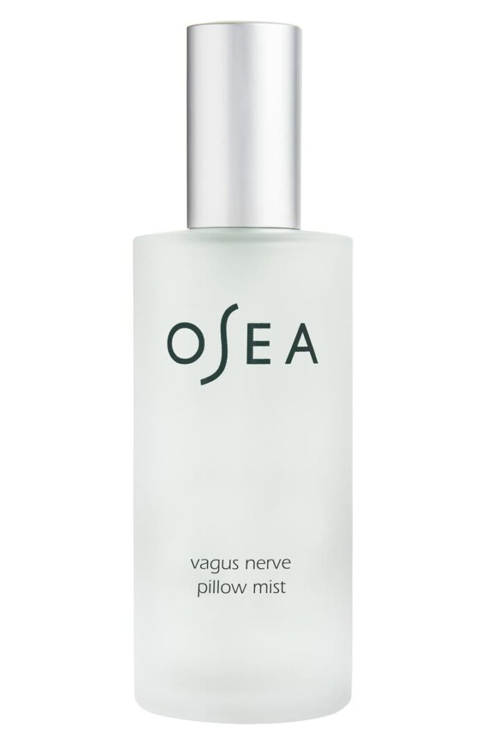 Osea Vagus Nerve Pillow Mist in a glass spray bottle with silver top. Product is a light green liquid.